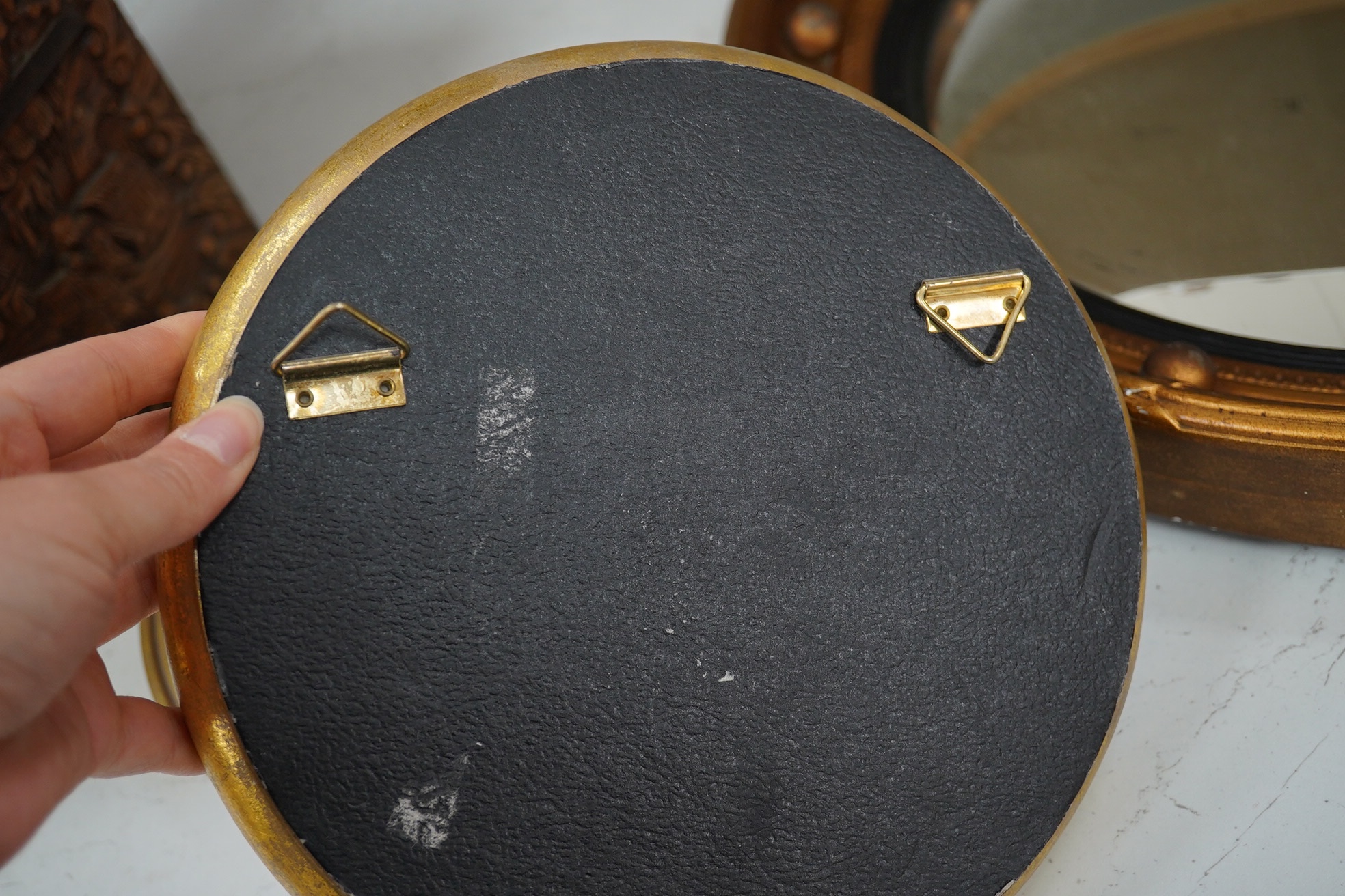 A convex gilt painted wall mirror and four small similar mirrors, convex mirror 46cm diameter (5). Condition - convex mirror, gilt scratched in places, others good